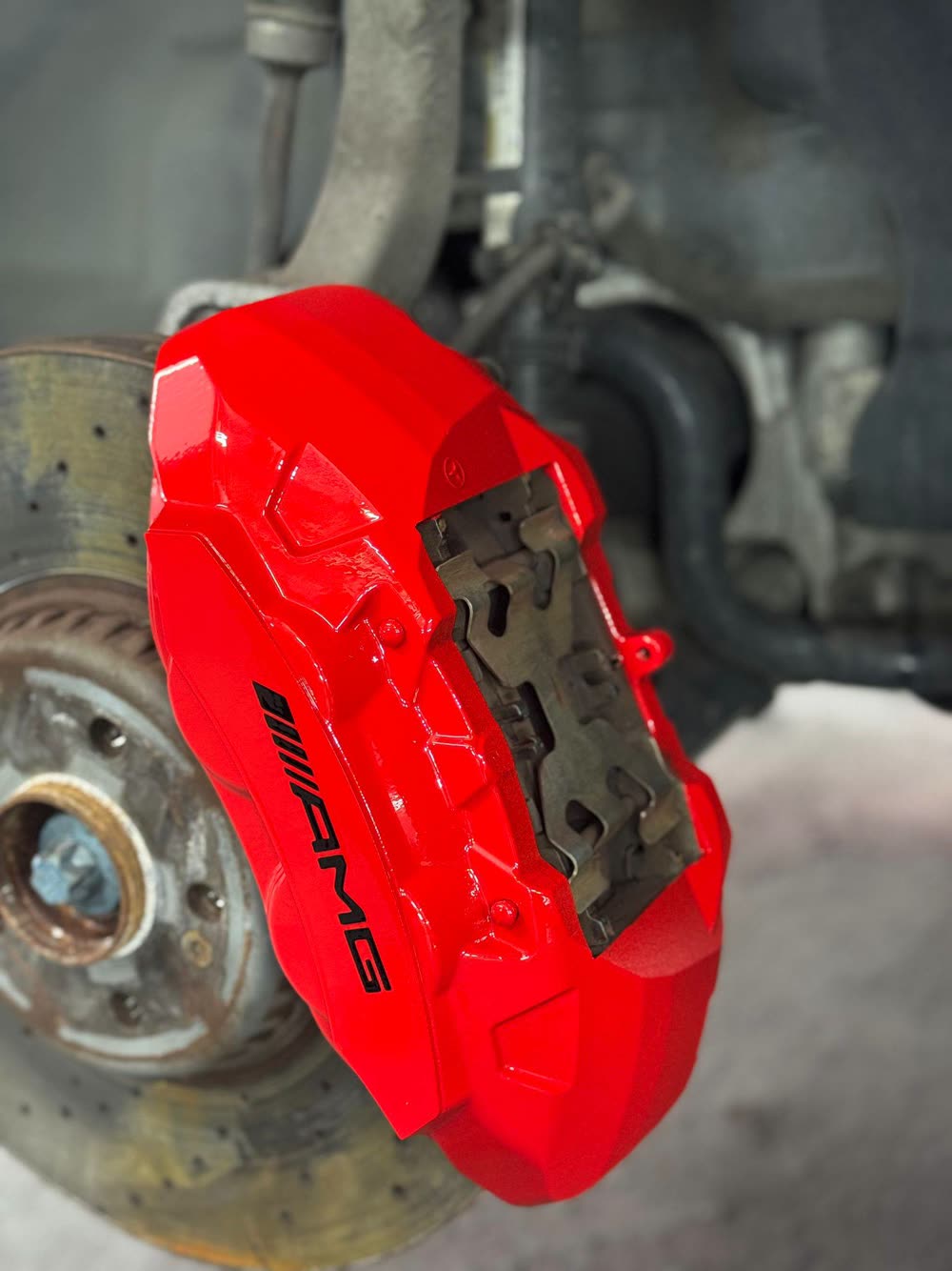 Mercedes-AMG brake caliper refinished in gloss red